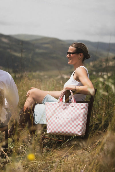 Pink Checkers tote at an outdoor gathering