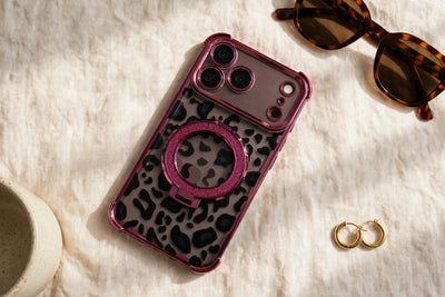 Leopard Ring-Stand Case in Burgundy styled with sunglasses and gold hoops